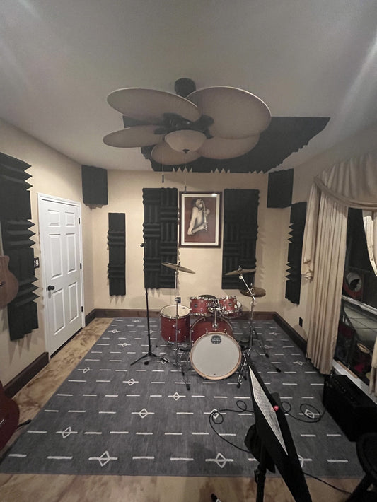 bedroom drum recording room treated with acoustic foam panels and corner bass traps